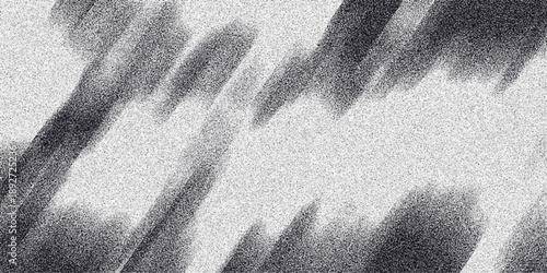 Dynamic abstract monochrome background with diagonal streaks of dark grainy texture against a lighter speckled field, suggesting motion and energy