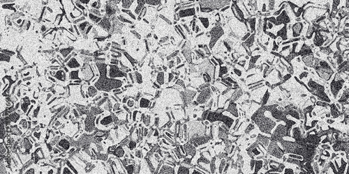 Monochrome abstract pattern with a mosaic of irregular geometric shapes in varying shades of grey and black, creating a textured, fragmented visual effect for graphic design backgrounds