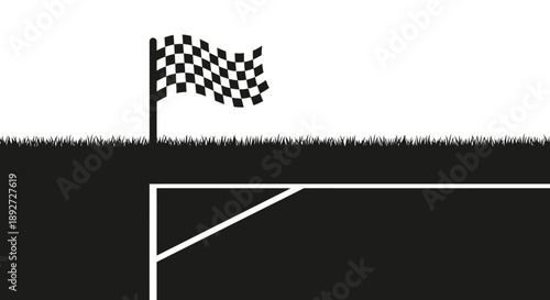 Checkered Finish Line Flag Waving Over a Grassy Race Track, Signifying the End of a Competition or Journey
