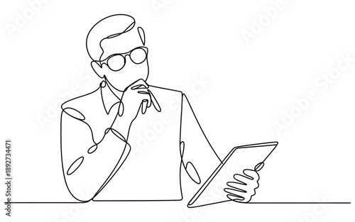 Man in glasses deep in thought, analyzing data on a tablet with focused concentration