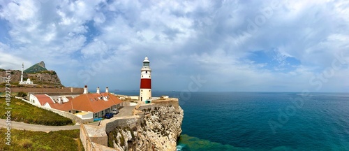 rocky coast of Gibraltar and King Fahd Bin Abdulaziz Al Saud Mosque and Europa Point Lighthouse, Rock of Gibraltar, Mediterranean Sea, Strait of GIbraltar, British Overseas Territrory