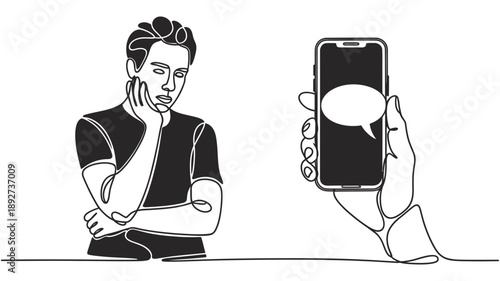 Young man showing frustration or boredom while waiting for a message on a mobile phone