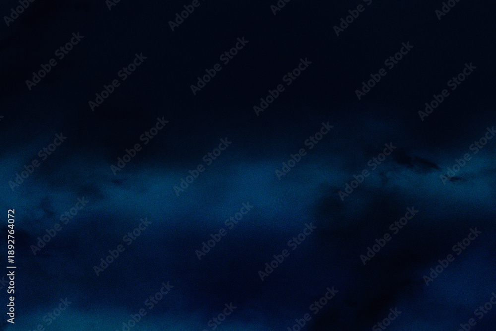 Fototapeta premium Deep blue and black background with fine grain. Dark, cinematic atmosphere ideal for elegant presentations, tech wallpapers, and text overlays.