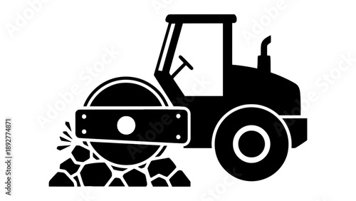 A steamroller compacts gravel on a construction site.