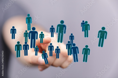 Hand pointing at human figu...