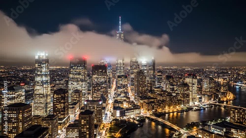 Urban landscape at night cityscape illuminated with glowing lights and dramatic sky