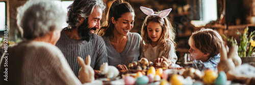 Wallpaper Mural Family enjoys time together at a decorated table for Easter. They exchange chocolate bunnies and colorful eggs while smiling and sharing laughter. Children express joy and excitement, banner Torontodigital.ca