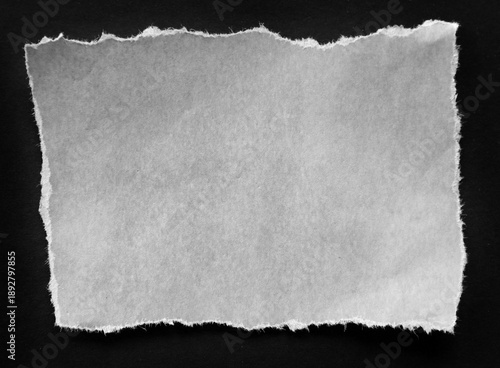 Torn paper on black