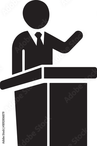 man standing at a podium and gesturing