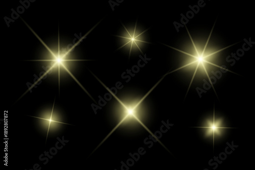 Golden sparkle lights, flashing lights, light effects, sunlight lens flare, glowing ray beams, sparkling starsicon on black background.