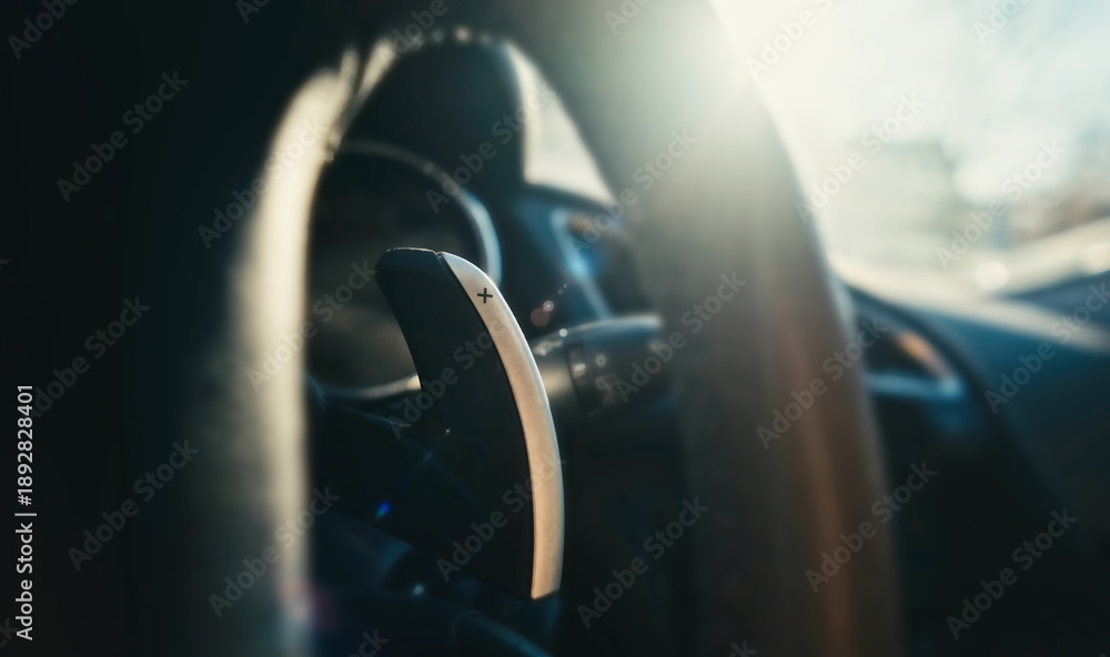 Naklejka premium Car Gear Selector On Steering Column Behind Car Wheel, Close-Up