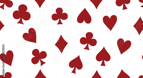 Seamless pattern of scattered red playing card suits on a white background, featuring hearts, diamonds, clubs, and spades for games and leisure.