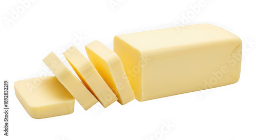 Unwrapped butter stick with several slices cut, showing its creamy texture and yellow color, isolated on a white background.