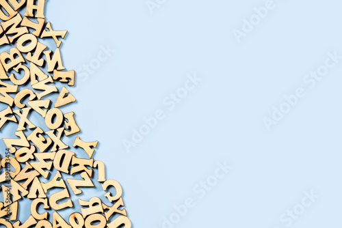 English letters of the alphabet on blue background on the left side.