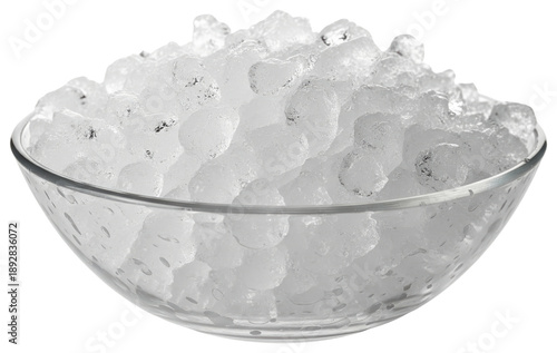 Clear glass bowl filled with crushed ice cubes close up on a transparent background