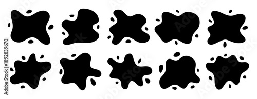 Set of black ink splatters including rounded liquid puddles and tiny droplet accents