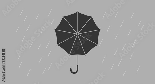 Black umbrella open protecting from rain.