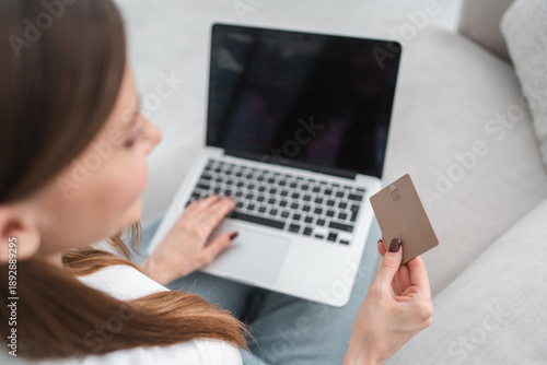 Credit card, black screen or girl on laptop in home for ecommerce sale on digital fintech website. Mockup space, payment or woman typing financial info for online shopping ads or internet banking