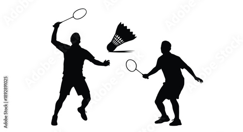 Badminton players in action with a shuttlecock a dramatic silhouette