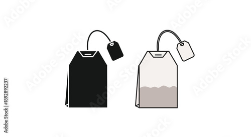 Two tea bags one dark and one light in stark contrast silhouette