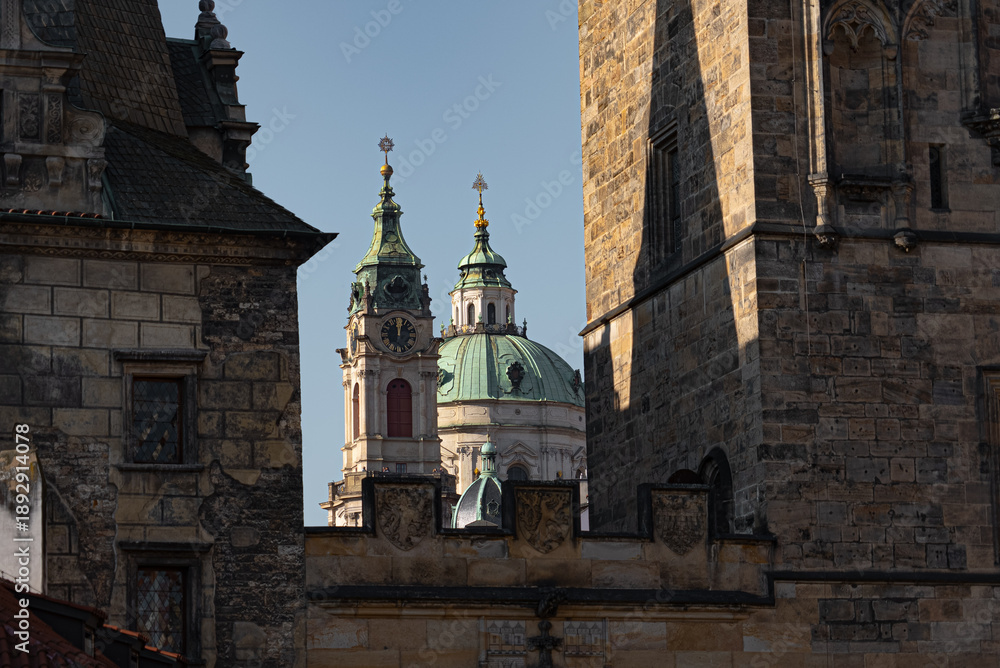 Obraz premium Saint Nicholas Church Dome Framed by Charles Bridge Towers