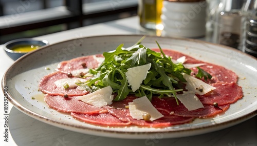 Elegant beef carpaccio with arugula and parmesan on ceramic plate olive oil drizzle in upscale restaurant food photography
