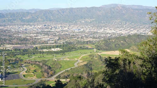 Wide right-to-left panoramic shot of the sprawling Los Angeles cityscape. Features Glendale, Burbank, and the iconic Forest Lawn Memorial Park.