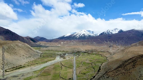 Aerial Highway Through Sichuan-Tibet Mountains with Snow-Capped Peaks