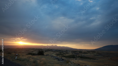 Sunset Over Mountains, Roads and Bridge