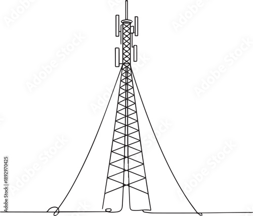Tall communication tower with antennas standing on a flat surface viewed from the side