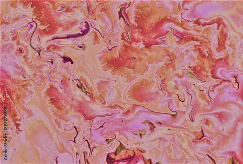 Abstract coral background. The acrylic paint flows freely and creates an interesting pattern.