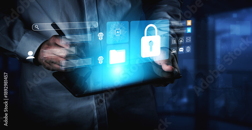 A business professional interacts with a tablet, visualizing concepts of digital security and artificial intelligence amidst a futuristic technology backdrop. Gantry