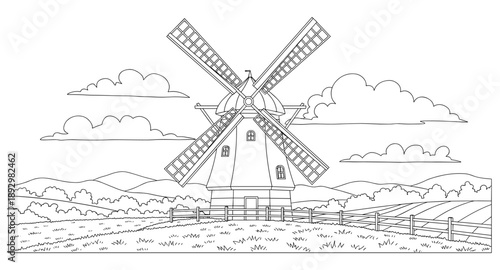 Classic windmill with large blades stands tall against a cloudy sky and rolling hills