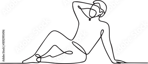 A woman sitting on the floor with her hand on her head in a relaxed pose