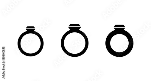 Three diamond rings of varying sizes displayed in a row on a white background