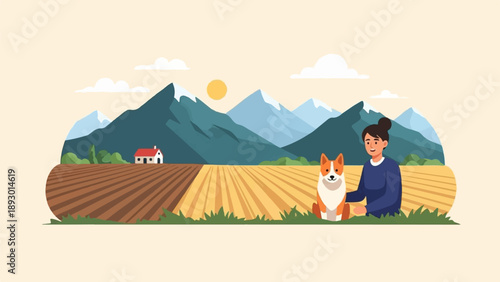 A person and dog sit in a field with mountains and a house in the background