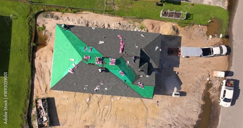 Wallpaper Mural Construction workers installing asphalt shingles on residential home. New house rooftop being built. Torontodigital.ca