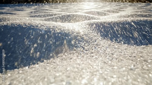 Close-up view of water surface with light reflections and ripples.