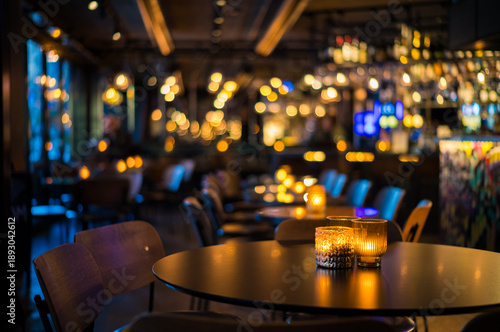 Elegant Ambient Dining Experience with Soft Candlelight and Warm Decorative Lighting in a Cozy, Modern Restaurant Interior