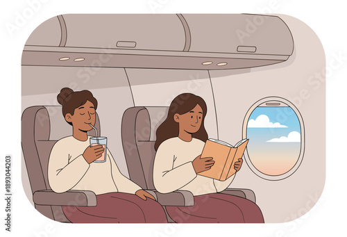 Women relaxing on airplane during flight