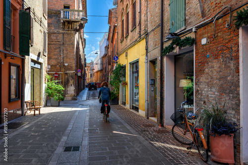 Cozy narrow street with bicycl in Ferrara, Emilia-Romagna, Italy. Ferrara is capital of the Province of Ferrara