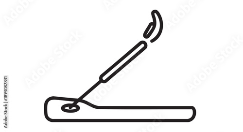 A lit matchstick being struck against a matchbox, viewed from a side angle