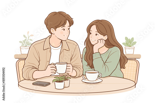Man and woman enjoying a quiet moment in a cafe, seated comfortably side by side with cups on the table and