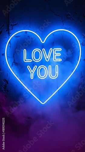 LOVE YOU neon sign in a heart shape glowing blue on a dark textured wall with pink smoke effect, romantic message for valentines day or anniversary