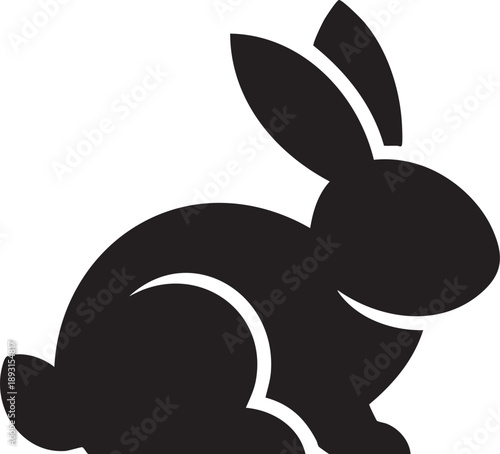 A black silhouette of a rabbit sitting on its haunches with ears perked up