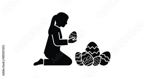 Child silhouette examines decorated Easter eggs.