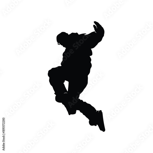 Silhouette of person jumping with skateboarding pose