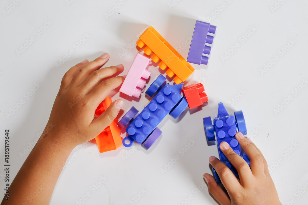 Fototapeta premium children building Lego 