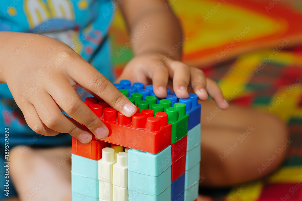 Fototapeta premium children building Lego 