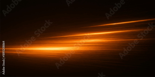 A beautiful summer landscape of a bright orange sun setting over the blue sea with fiery red clouds painting a colorful evening sky at dusk